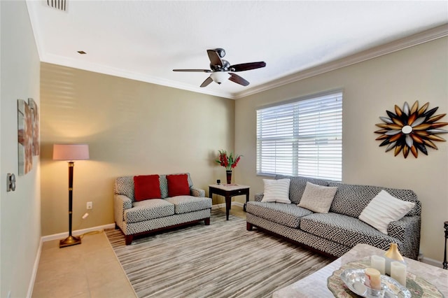 living room with ceiling fan, ornamental molding, and light tile patterned flooring