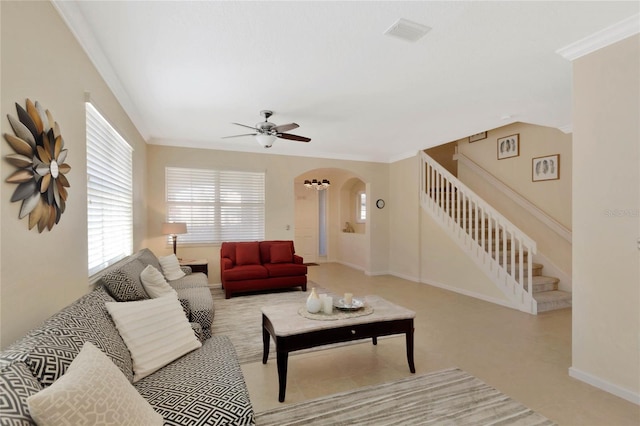 living room featuring crown molding and ceiling fan