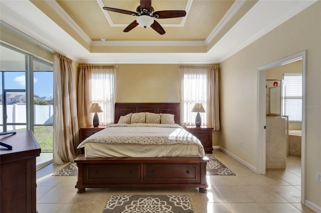 bedroom featuring a raised ceiling, access to exterior, ceiling fan, and multiple windows