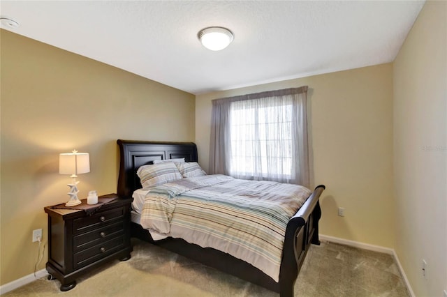 bedroom with light carpet