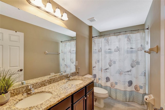 bathroom featuring tile patterned flooring, vanity, a shower with shower curtain, and toilet