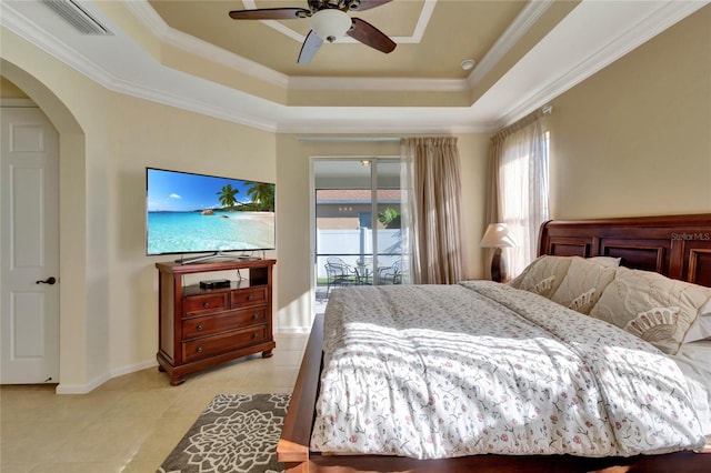 bedroom with ceiling fan, a raised ceiling, light tile patterned floors, and access to outside