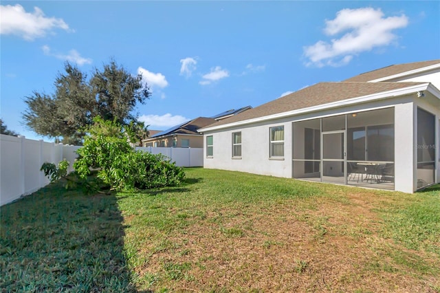 view of yard featuring a sunroom