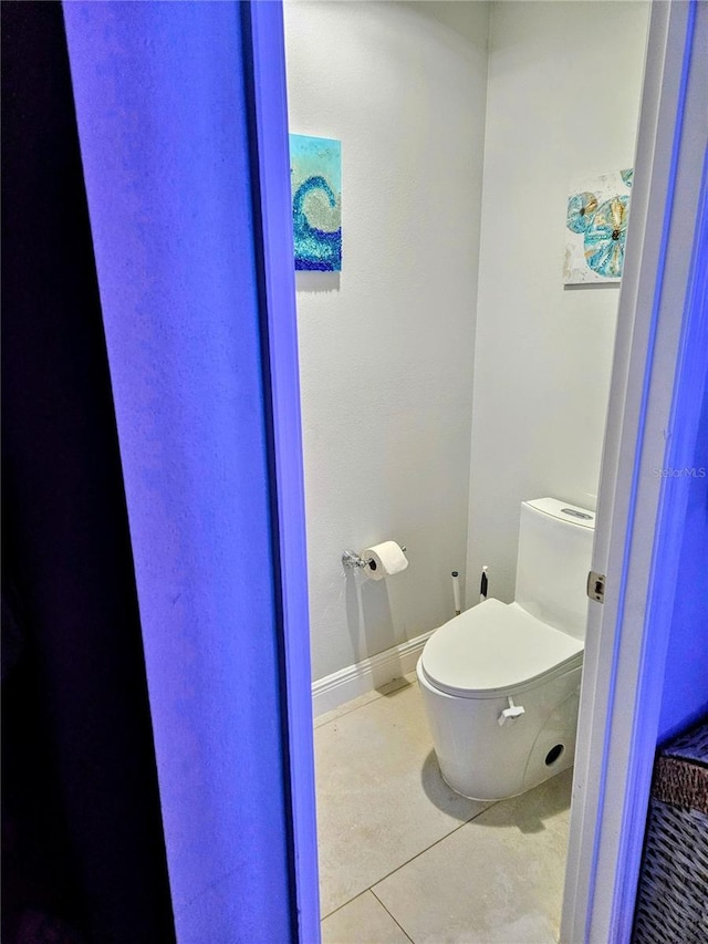 bathroom featuring tile patterned floors and toilet