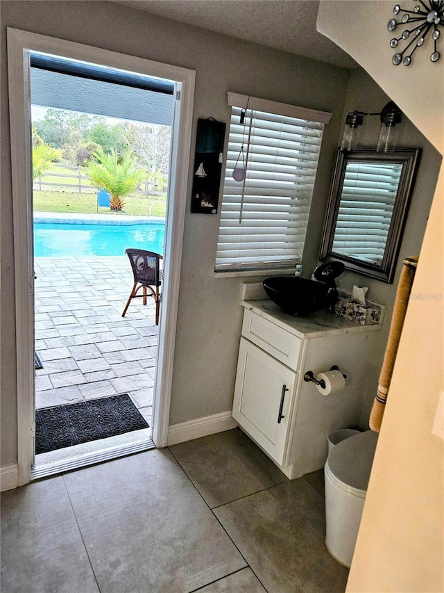 bathroom with tile patterned flooring and vanity