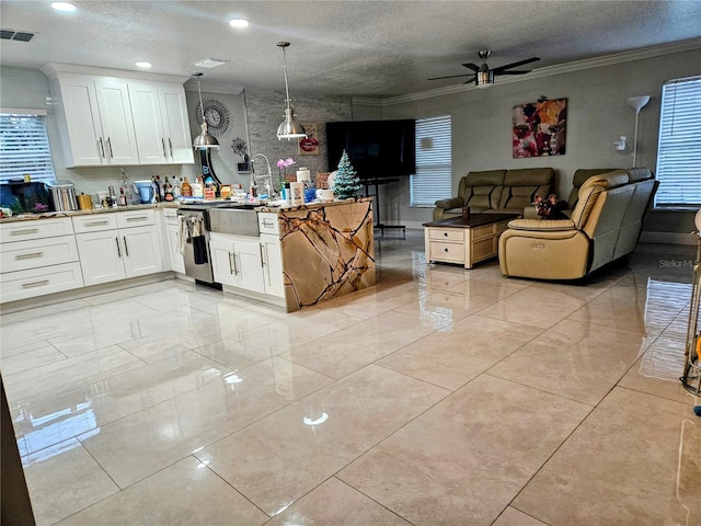 kitchen with kitchen peninsula, a textured ceiling, ceiling fan, decorative light fixtures, and white cabinets