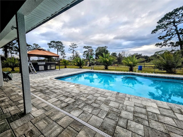 view of pool featuring a gazebo and a patio area