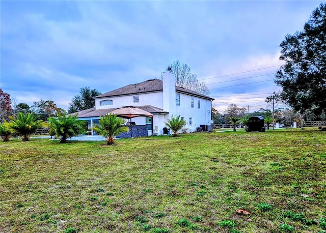 view of property exterior featuring a gazebo and a lawn