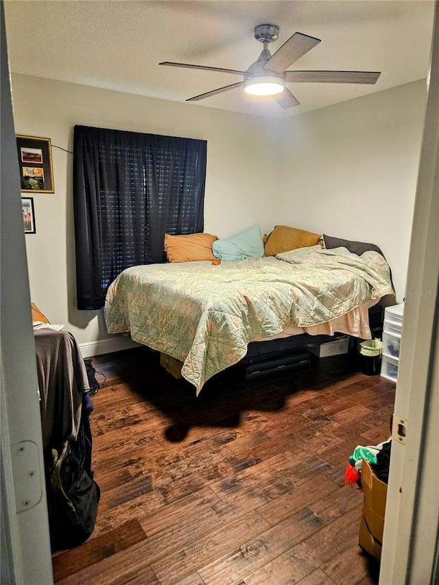 bedroom featuring hardwood / wood-style floors and ceiling fan