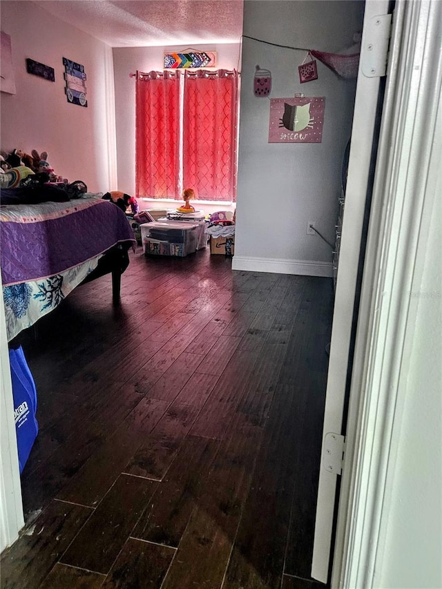 bedroom featuring wood-type flooring