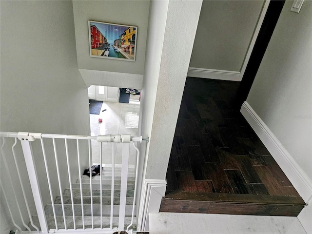 stairway with wood-type flooring