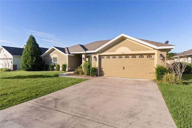 ranch-style house with a garage and a front lawn