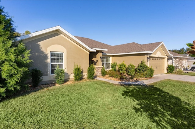 single story home featuring a front yard and a garage