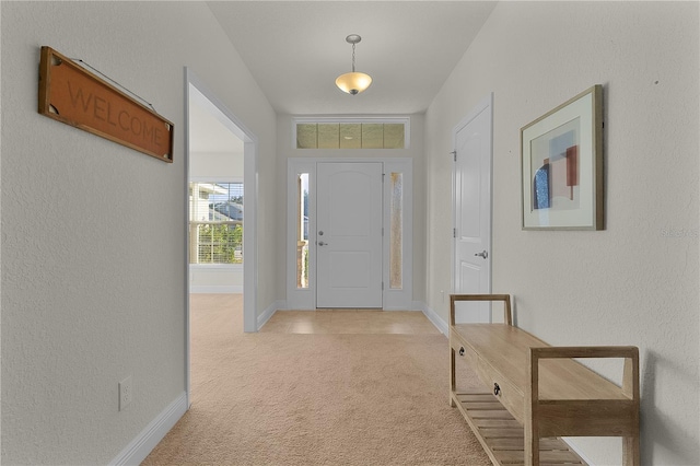 foyer with light carpet