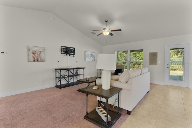 carpeted living room featuring vaulted ceiling and ceiling fan