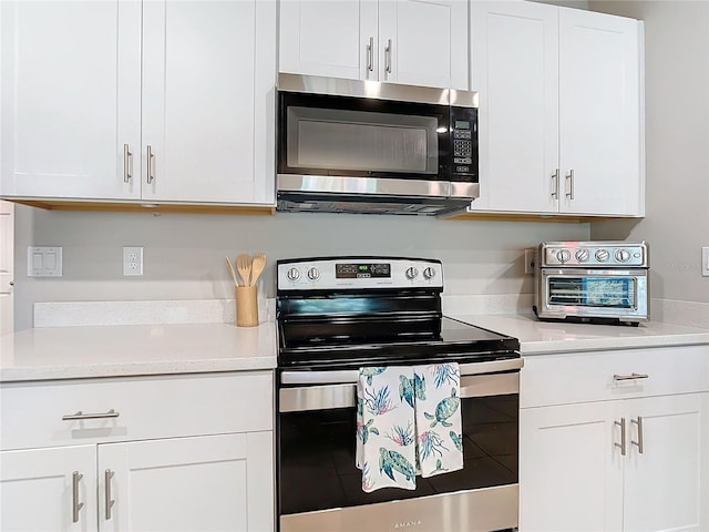 kitchen with white cabinets and stainless steel appliances