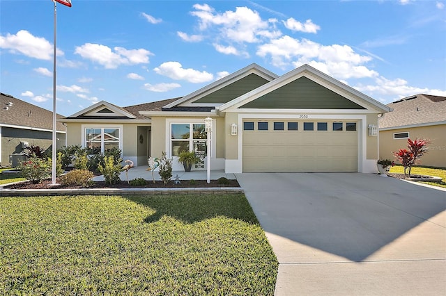 view of front of home featuring a garage and a front lawn