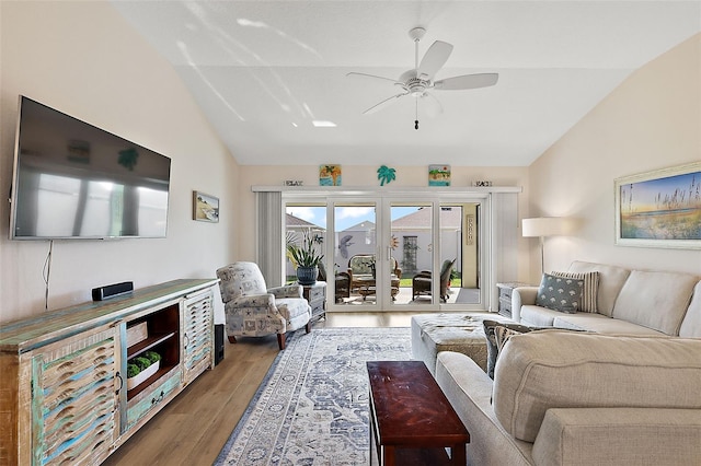 living room featuring ceiling fan, vaulted ceiling, and hardwood / wood-style flooring