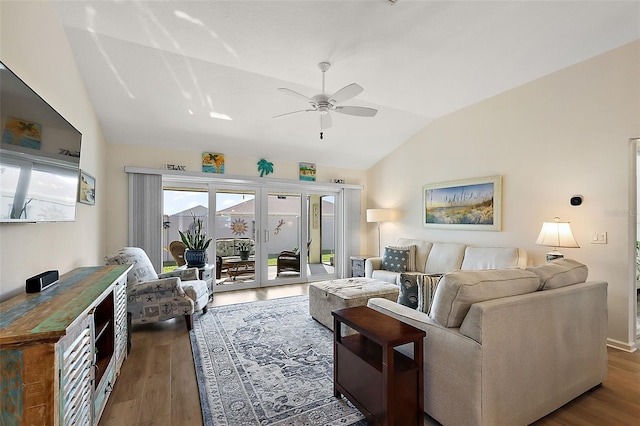 living room with french doors, ceiling fan, dark hardwood / wood-style flooring, and lofted ceiling