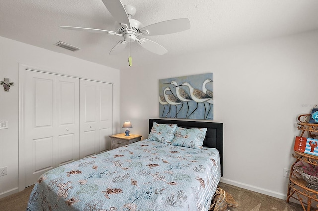 carpeted bedroom with a closet and ceiling fan