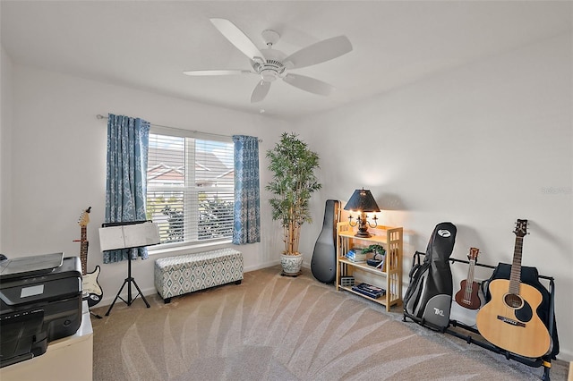 interior space featuring carpet flooring and ceiling fan