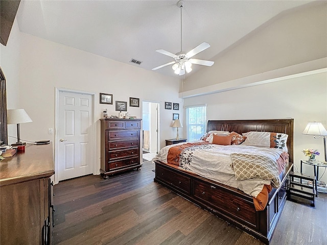 bedroom with ceiling fan, dark hardwood / wood-style floors, and lofted ceiling