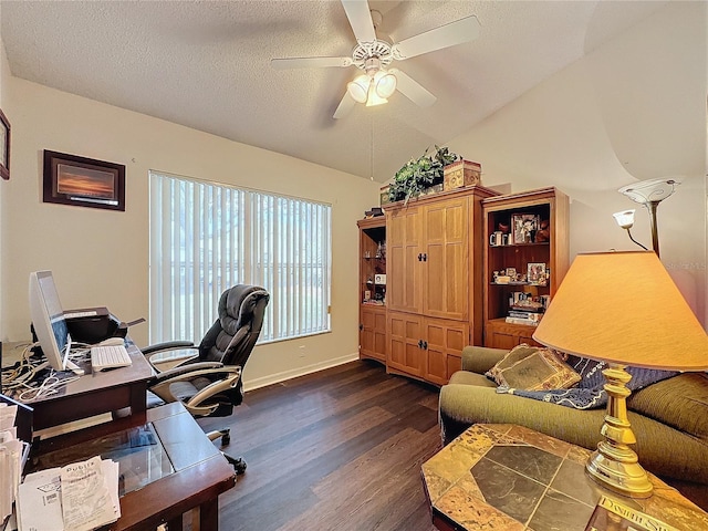 office area featuring a textured ceiling, ceiling fan, dark wood-type flooring, and vaulted ceiling