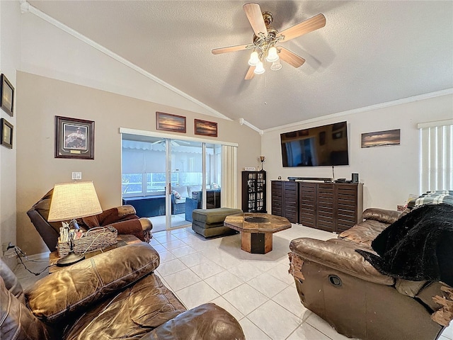 tiled living room with a textured ceiling, ceiling fan, lofted ceiling, and ornamental molding