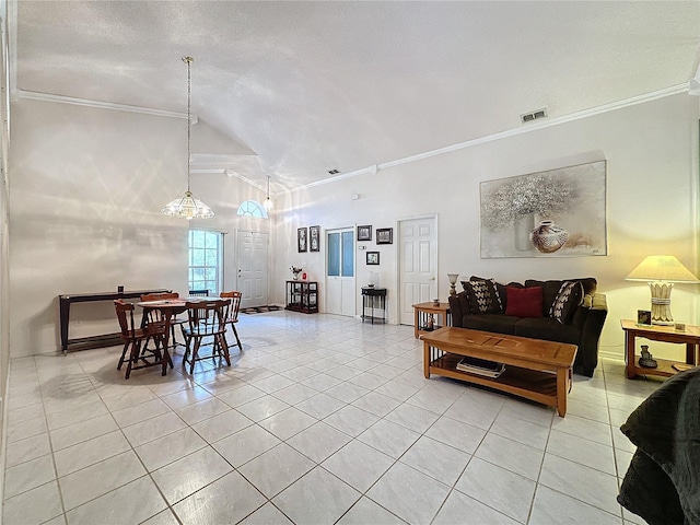 tiled living room featuring a textured ceiling, high vaulted ceiling, and ornamental molding