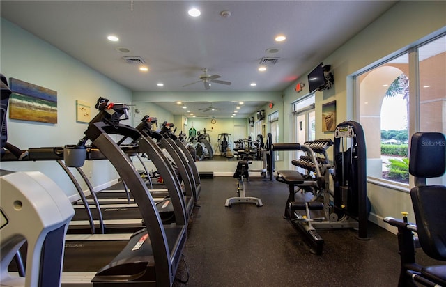 exercise room with ceiling fan