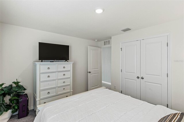 bedroom with a closet and carpet