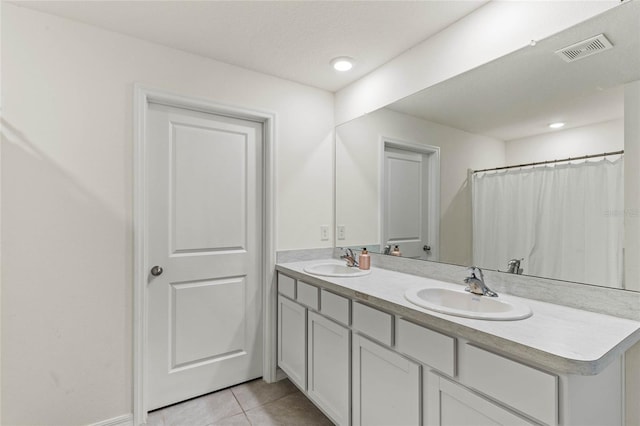 bathroom with tile patterned flooring, vanity, and a shower with shower curtain