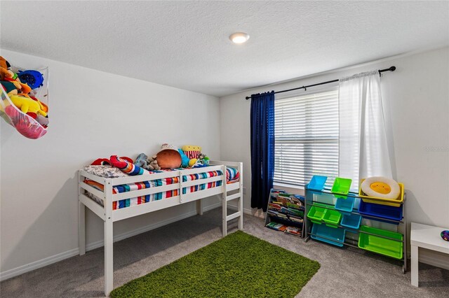 carpeted bedroom with a textured ceiling