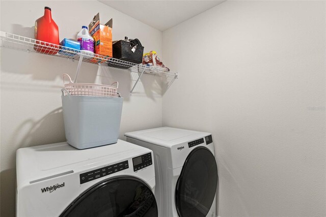 clothes washing area with independent washer and dryer