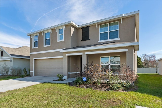 view of front of home with a front lawn and a garage