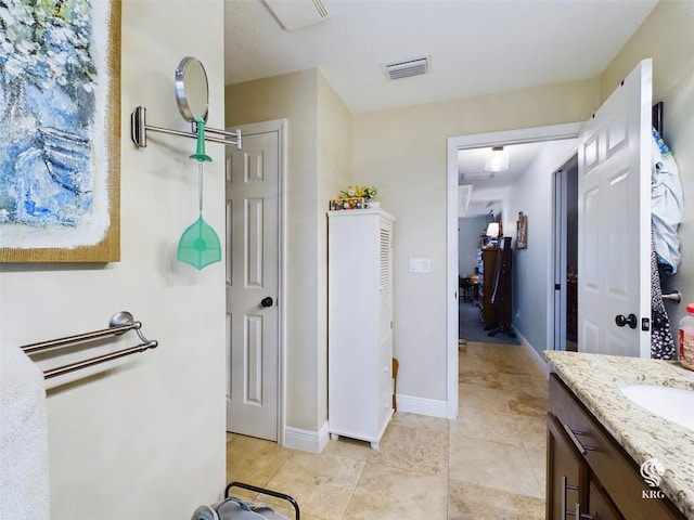 bathroom featuring tile patterned floors and vanity