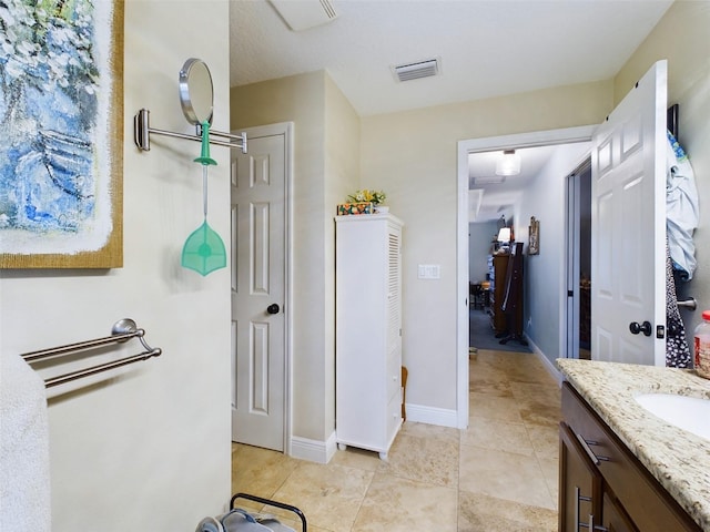 bathroom with vanity and tile patterned floors