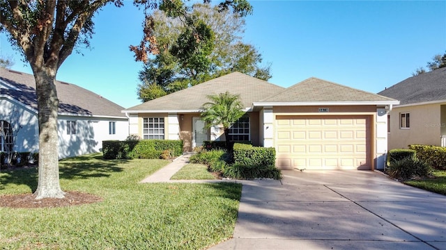 ranch-style house featuring a garage and a front yard