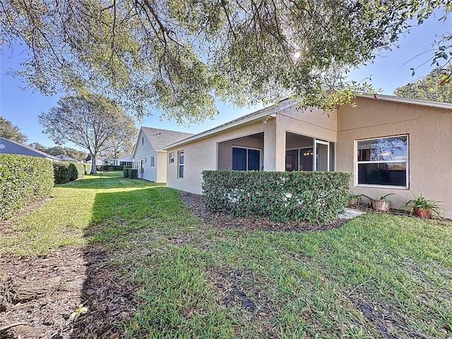 view of side of property featuring a yard