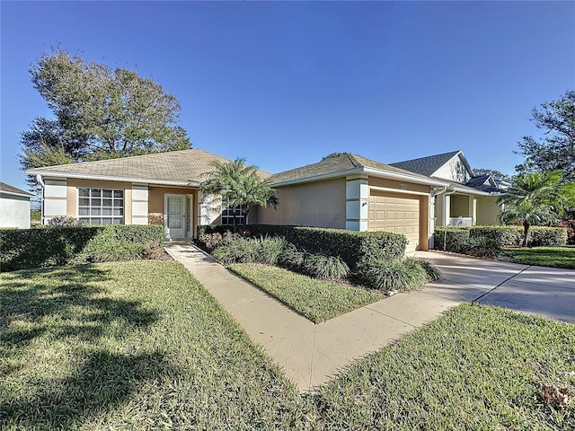 ranch-style home with a front lawn and a garage