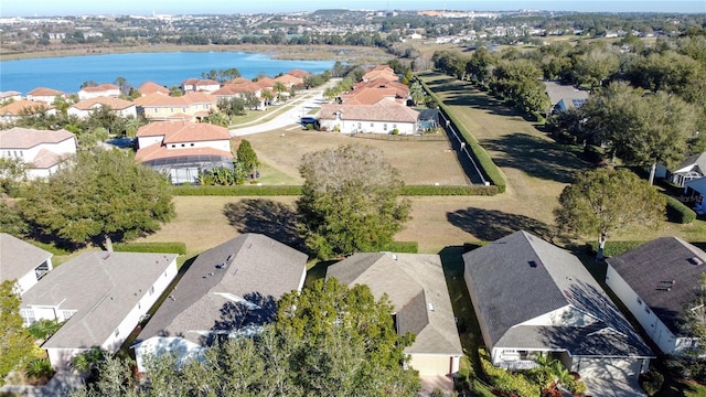 drone / aerial view with a water view