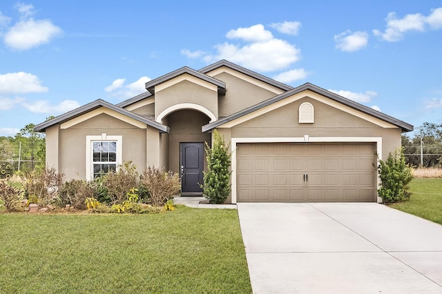 ranch-style house with a garage and a front yard