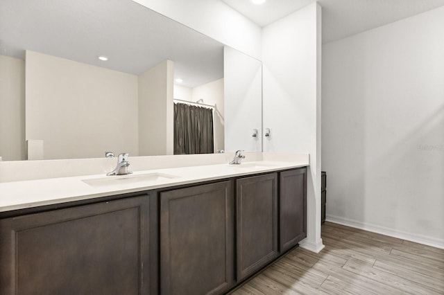 bathroom with walk in shower and vanity