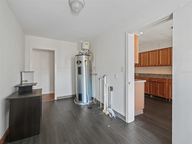 interior space with dark wood-type flooring and water heater