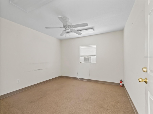 spare room featuring cooling unit and ceiling fan