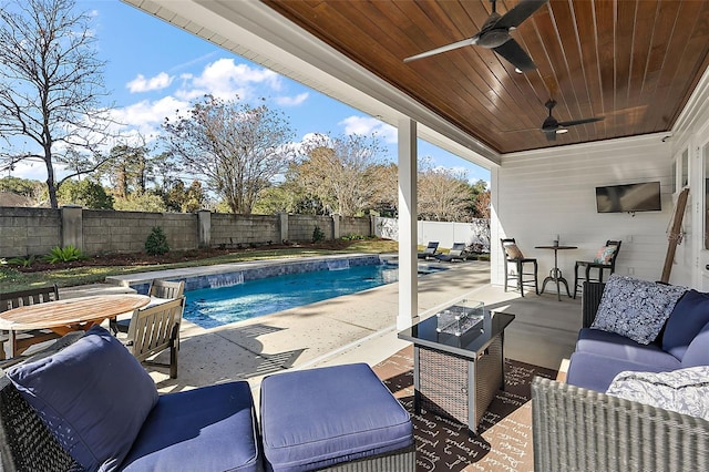 view of swimming pool with ceiling fan, a patio area, and an outdoor hangout area