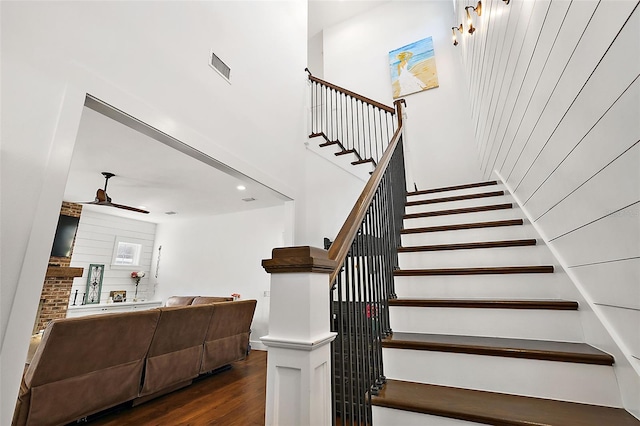 stairway with hardwood / wood-style floors