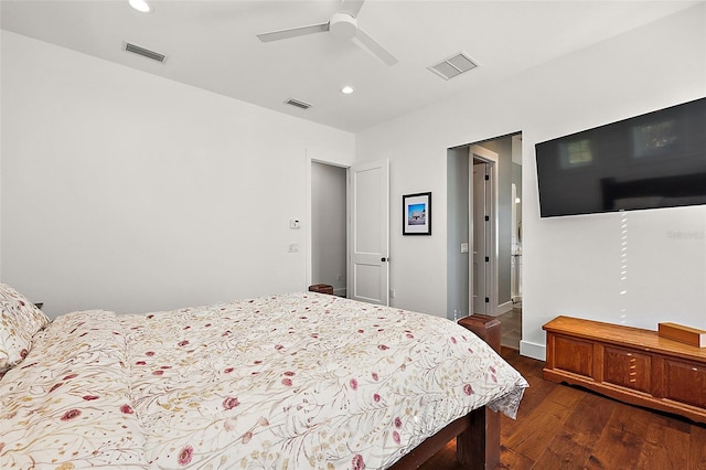 bedroom with dark hardwood / wood-style floors and ceiling fan