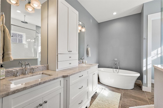 bathroom with separate shower and tub, tile patterned floors, vanity, and a healthy amount of sunlight