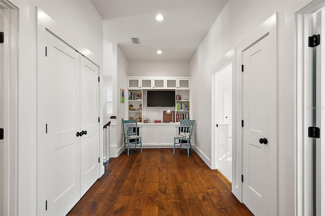 hallway featuring dark wood-type flooring